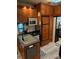 Galley kitchen with ample cabinetry and appliances at 204 Lake Tillery Trl, Mount Gilead, NC 27306