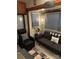 Cozy living space featuring a sleeper sofa and recliner at 204 Lake Tillery Trl, Mount Gilead, NC 27306