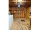 Interior of a well-lit storage shed with shelving at 204 Lake Tillery Trl, Mount Gilead, NC 27306