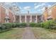 Brick building with a central courtyard and manicured hedges at 2240 Roswell Ave # 4, Charlotte, NC 28207