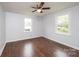 Large bedroom with wood-look flooring, multiple windows, and ceiling fan at 2752 21St Ne St, Hickory, NC 28601