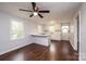 Eat-in kitchen with white cabinets, island, and hardwood floors at 2752 21St Ne St, Hickory, NC 28601