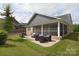 Brick patio with seating area and grill, offering a relaxing outdoor space at 3516 Marchers Trace Dr, Mint Hill, NC 28227