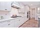 Modern kitchen with white cabinets, granite countertops, and gas cooktop at 3516 Marchers Trace Dr, Mint Hill, NC 28227