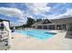 Community pool with lounge chairs and patio tables at 3516 Marchers Trace Dr, Mint Hill, NC 28227