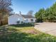 House exterior showcasing backyard and a spacious concrete patio at 3916 Cedarbark Dr, Matthews, NC 28105