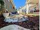 Landscaped backyard with stone and mulch at 4014 Pleasant Run Dr, Matthews, NC 28104