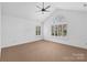 Spacious bedroom featuring high ceilings and a large window at 4875 Polo Gate Blvd, Charlotte, NC 28216