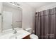 Simple bathroom with single vanity and shower/tub combo at 5502 Henderson Oaks Dr, Charlotte, NC 28269