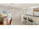 Kitchen boasts a breakfast bar, granite countertops, and stainless steel appliances at 5502 Henderson Oaks Dr, Charlotte, NC 28269