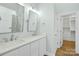 Double vanity bathroom with marble shower and walk-in closet access at 1021 York Rd, Kings Mountain, NC 28086