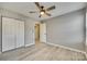 Bedroom with ceiling fan and double door closet at 14320 Carolina Forest Ct, Charlotte, NC 28273