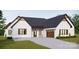 White brick home with dark gray roof, brown garage door, and landscaping at 150A Lookout Dam Rd, Statesville, NC 28625