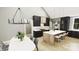 Modern kitchen with dark cabinetry, large island, and chandelier at 150A Lookout Dam Rd, Statesville, NC 28625