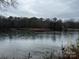 Serene waterfront lot with scenic river views and lush trees at 150A Lookout Dam Rd, Statesville, NC 28625
