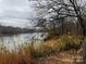 Serene riverfront property with lush vegetation and a tranquil atmosphere at 150A Lookout Dam Rd, Statesville, NC 28625