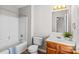 Clean bathroom with wood vanity, white toilet and bathtub at 203 Carwen Ct, Kannapolis, NC 28081