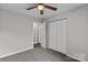 Bedroom with double door closet and ceiling fan at 203 Carwen Ct, Kannapolis, NC 28081