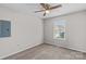 Simple bedroom with ceiling fan and window at 203 Carwen Ct, Kannapolis, NC 28081