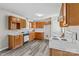 Galley style kitchen with wood cabinets and vinyl flooring at 203 Carwen Ct, Kannapolis, NC 28081