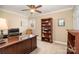 Home office with built-in bookshelves, desk, and comfortable seating at 21315 Blakely Shores Dr, Cornelius, NC 28031