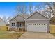 Gray house with white garage door and blue front door at 2620 Craig Ave, Concord, NC 28027