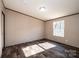 Simple bedroom with large window and wood-look floors at 3365 34Th Avenue Ne Ct, Hickory, NC 28601