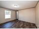 Bright bedroom featuring a large window and wood-look floors at 3365 34Th Avenue Ne Ct, Hickory, NC 28601