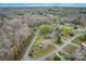 Aerial view showcasing home and neighborhood setting, including nearby roads and trees at 3842 22Nd Street Ne Ct, Hickory, NC 28601