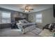 Primary bedroom with king bed and gray walls at 3842 22Nd Street Ne Ct, Hickory, NC 28601