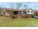 Brick ranch home with covered porch and landscaped yard at 3842 22Nd Street Ne Ct, Hickory, NC 28601