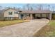 Brick ranch home with covered patio and carport at 3842 22Nd Street Ne Ct, Hickory, NC 28601