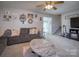 Living room with sectional sofa and view of staircase at 3842 22Nd Street Ne Ct, Hickory, NC 28601