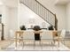 Elegant dining room with a wood table, six light-beige chairs, and a modern rug at 4054 Skyboat Cir, Fort Mill, SC 29715