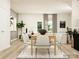 Bright dining room with a wooden table and six light-grey chairs at 4058 Skyboat Cir, Fort Mill, SC 29715