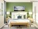 Relaxing bedroom with a green accent wall and stylish decor at 4499 Potters Wheel Dr, Fort Mill, SC 29715