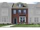 Brick front exterior of a two-story home with a dormer window and landscaping at 4503 Potters Wheel Dr, Fort Mill, SC 29715