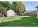 Spacious backyard with shed and wooden fence at 6712 Colonial Garden Dr, Huntersville, NC 28078