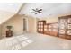 Large bonus room with built in wooden cabinets and a ceiling fan at 6712 Colonial Garden Dr, Huntersville, NC 28078