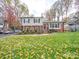 Brick and vinyl ranch home with a welcoming front porch at 6815 Castlegate Dr, Charlotte, NC 28226