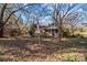 Small green house with porch and American flag in yard at 6911 Old Concord Rd, Salisbury, NC 28146