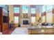 Two-story living room with a fireplace and hardwood floors at 708 Ridge Lake Dr, Weddington, NC 28104