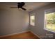 Cozy bedroom with hardwood floors and ceiling fan at 809 Pine Forest Rd, Charlotte, NC 28214