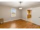 Hardwood floor dining room with views into kitchen at 162 Jennings Rd, Statesville, NC 28625