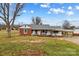 Brick ranch house with a large yard and carport at 162 Jennings Rd, Statesville, NC 28625