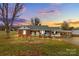 Brick ranch home with covered porch and carport, situated on a spacious lot at 162 Jennings Rd, Statesville, NC 28625
