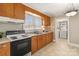 Kitchen with wood cabinets, and an electric range at 162 Jennings Rd, Statesville, NC 28625