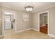 Kitchen with access to laundry and additional rooms at 162 Jennings Rd, Statesville, NC 28625