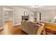 Hardwood floor living room with fireplace and view into another room at 162 Jennings Rd, Statesville, NC 28625