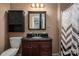 Bathroom with dark wood vanity and a shower/tub combo at 1925 Pl Propst Rd, Maiden, NC 28650